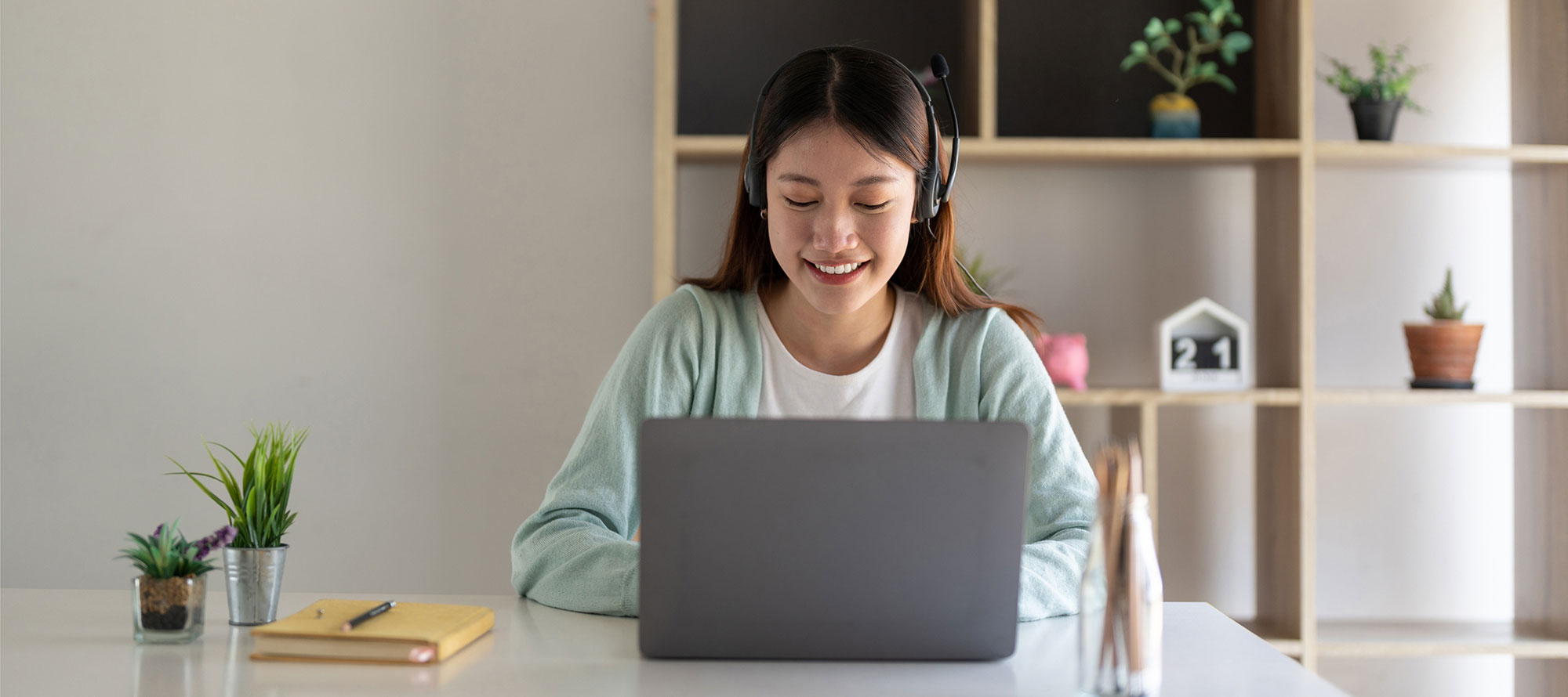 Smiling student at laptop computer