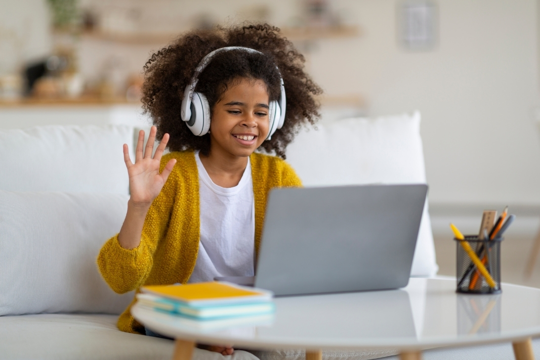Student learning asynchronously with headphones